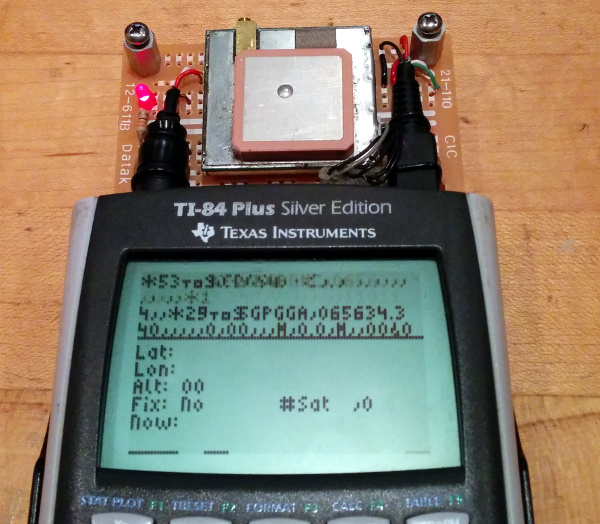 GPS module above TI-84 Plus Silver Edition graphing calculator