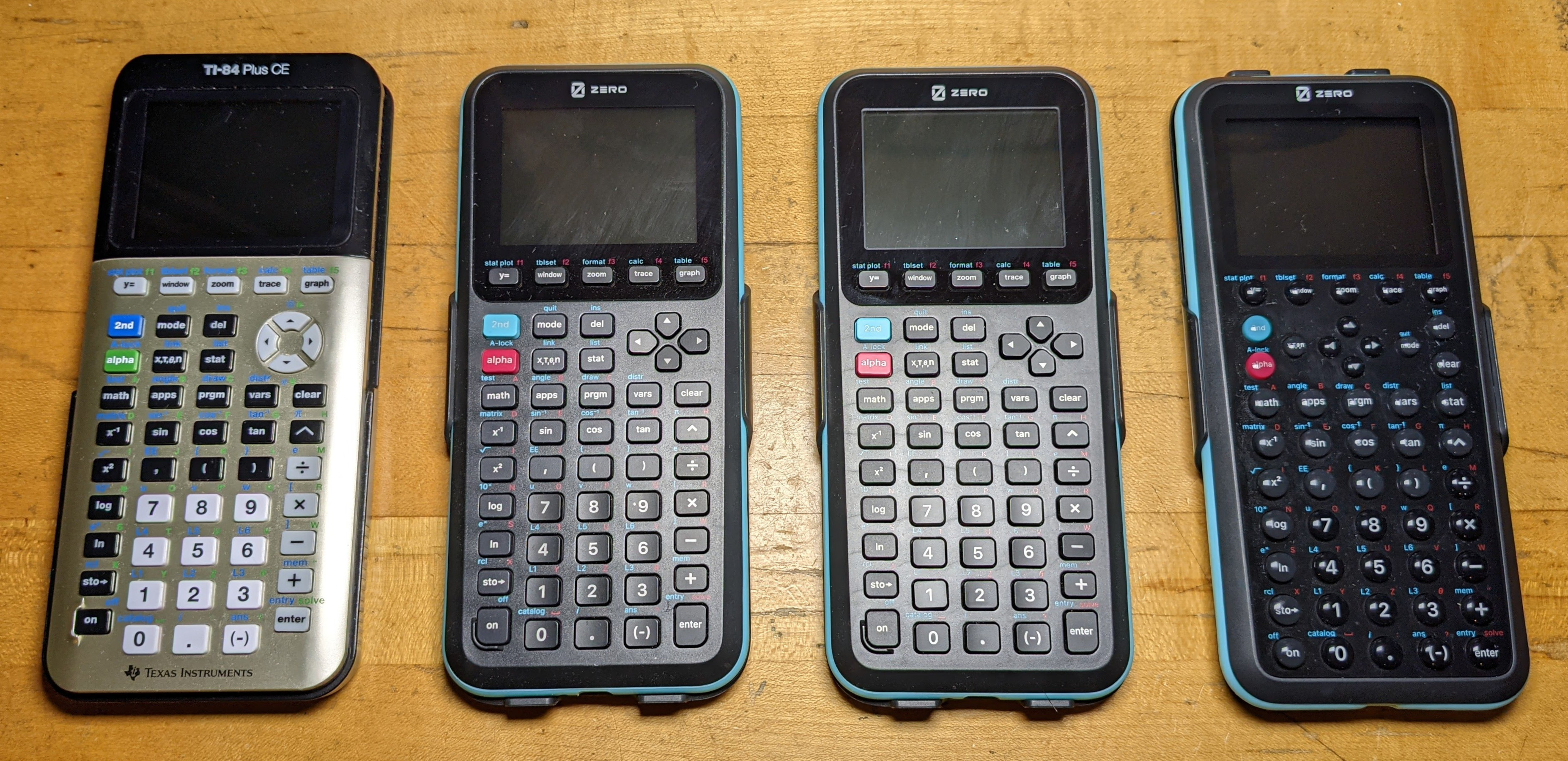 A TI-84 Plus CE with three Zero Calculators graphing calculators